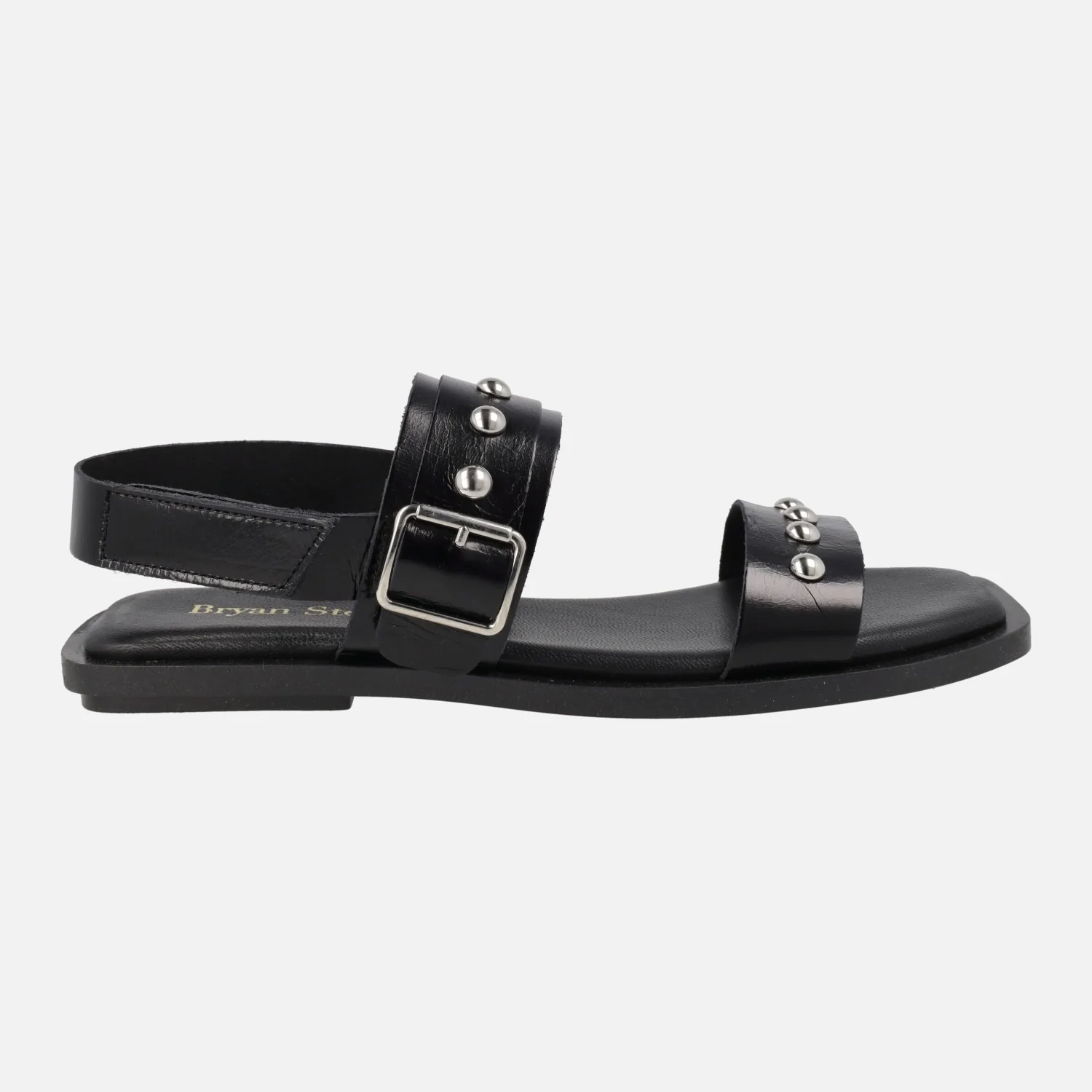 Sandalias planas de piel negra con hebilla y tachas plateadas